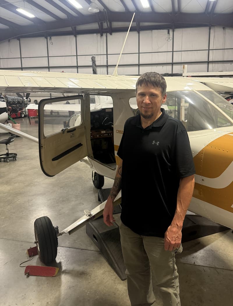 AMP working on a Cessna in a hangar at the KUAO airport in Oregon.