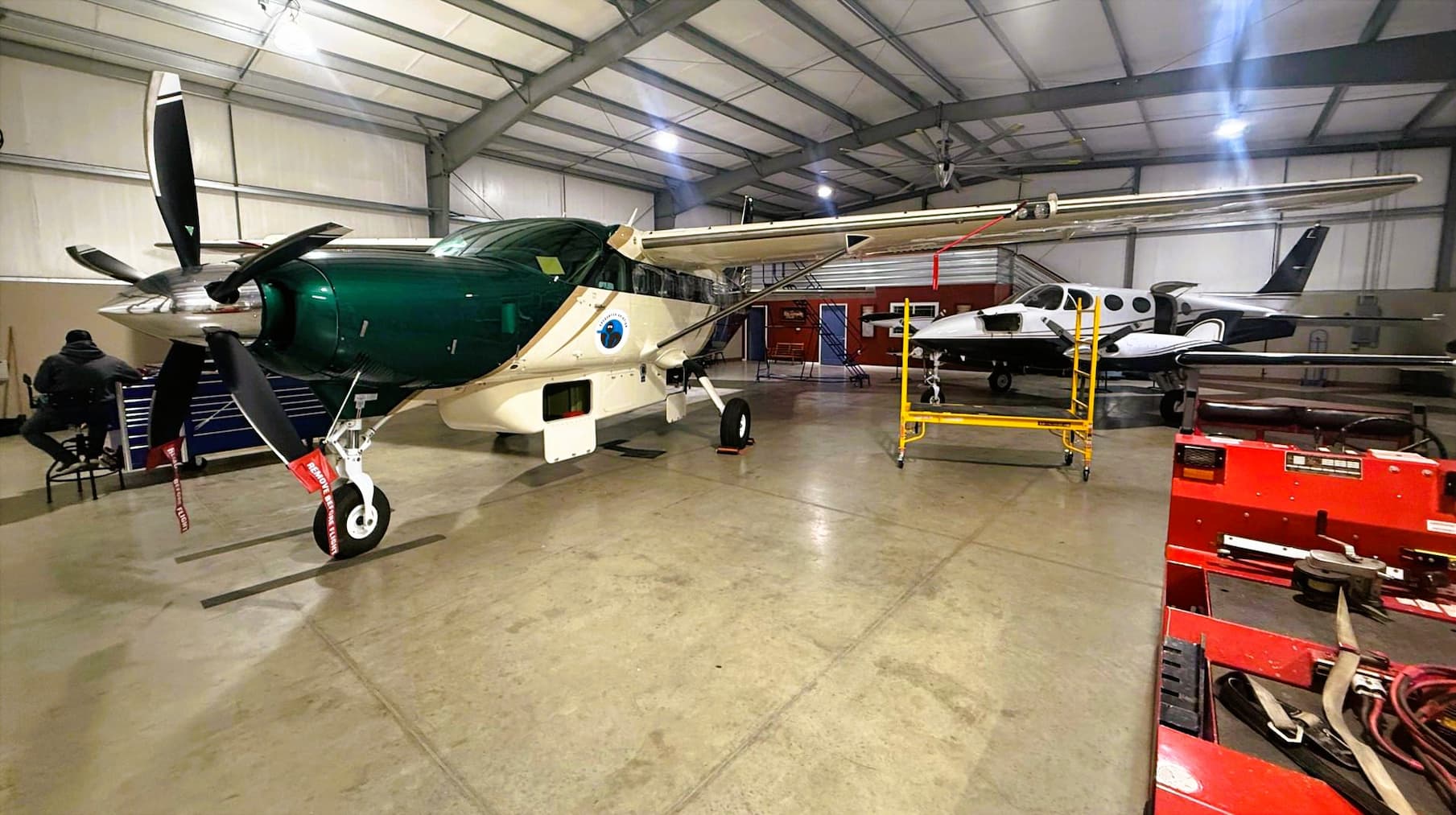 Cessna 340 and Caravan in hanger for maintenance