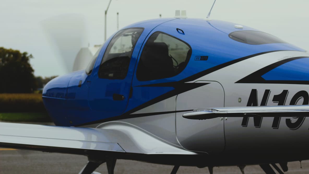 Cirrus aircraft ready for takeoff, pilot in cockpit