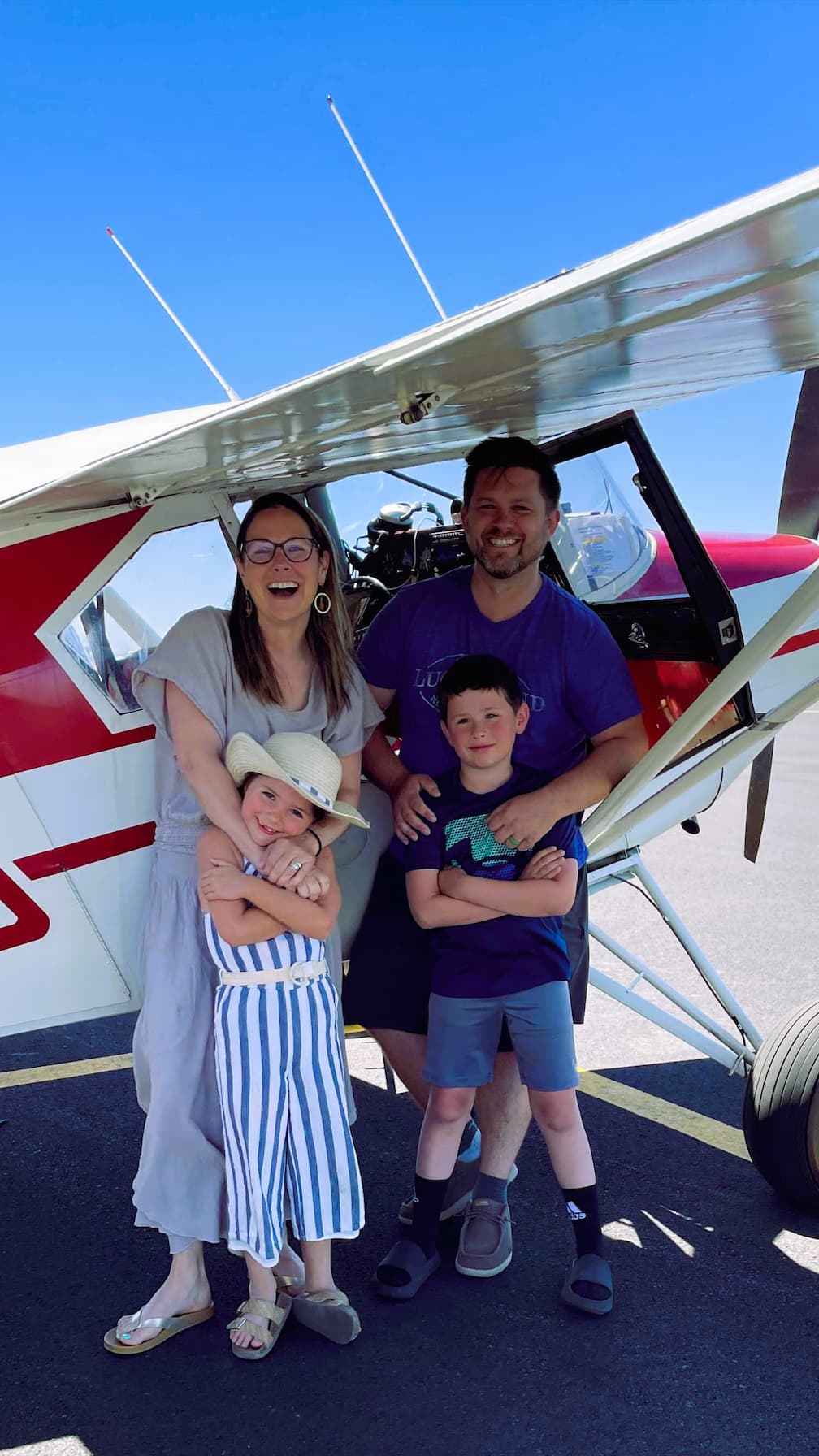 Family ready for a flight in their airplane. On the runway and ready to take off on a beautiful Oregon day.