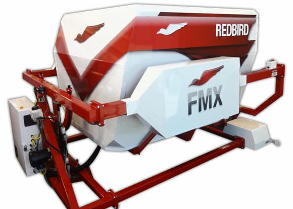 Red and white flight simulator with 'Redbird' and 'FMX' branding.