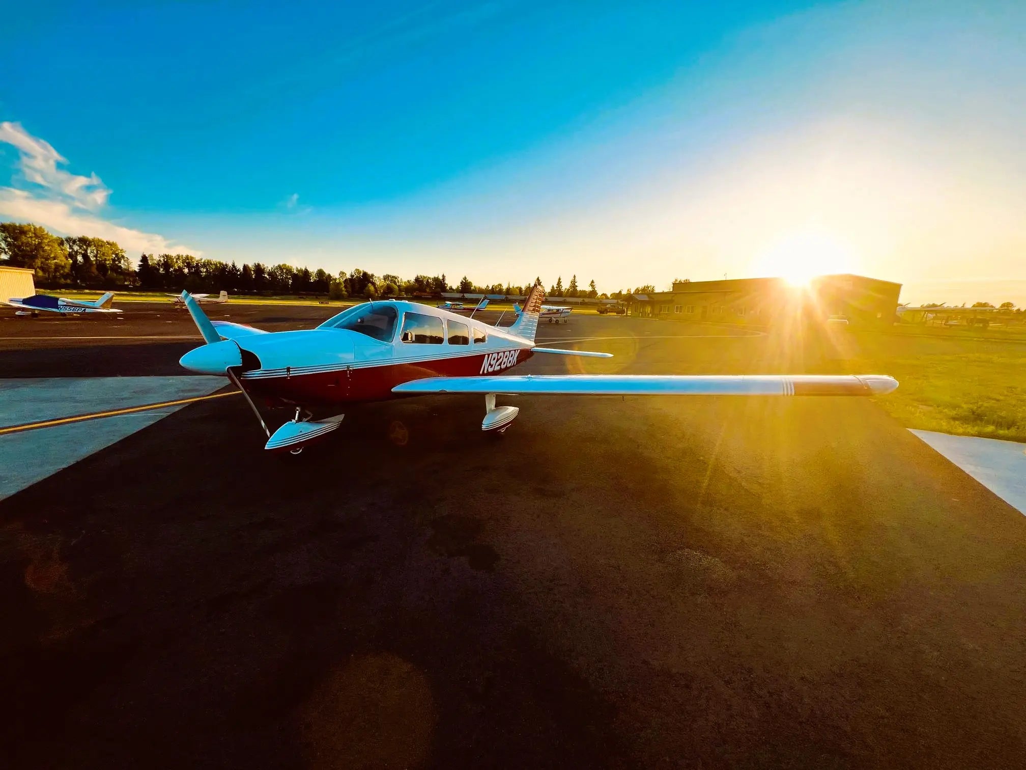 Piper Archer training airplane on a sunny runway at an Oregon flight school